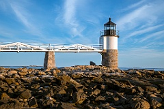 Marshall Point Lighthouse on Rocky Shoreline at Low Tide